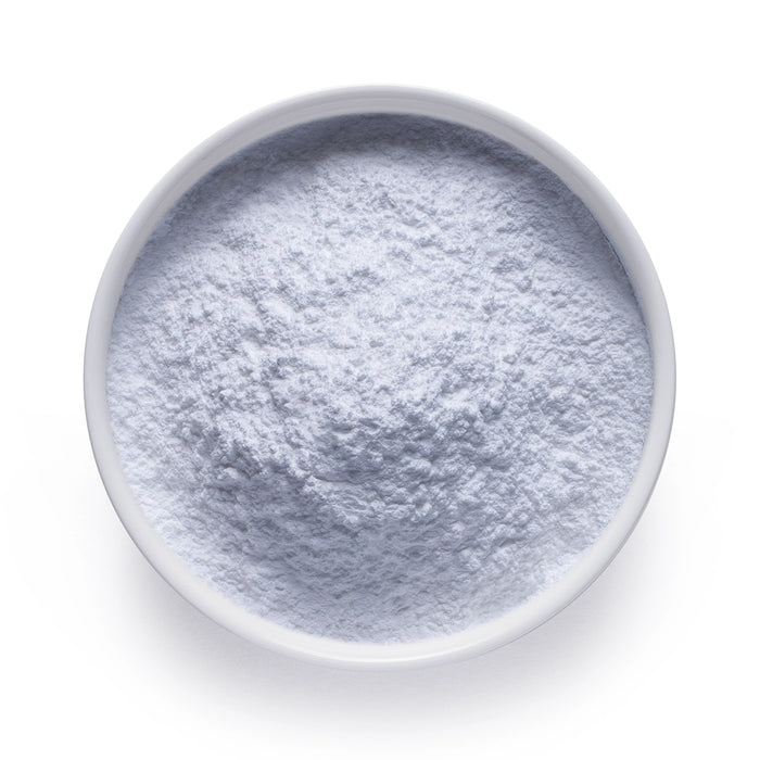 Bulk organic zinc citrate powder in a white ceramic bowl, wholesale superfood ingredient by Dolce Superfoods