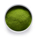 A white bowl of vibrant Ceremonial Reserve Matcha Powder from Dolce Superfoods Wholesale