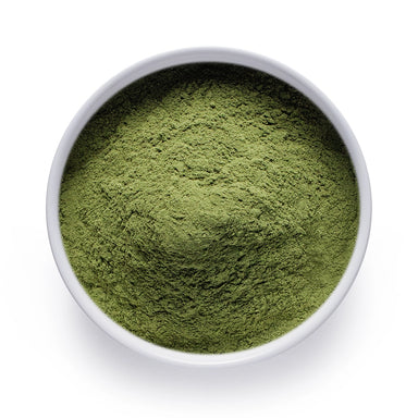 Bulk organic barley grass powder in a white ceramic bowl, wholesale superfood ingredient by Dolce Superfoods