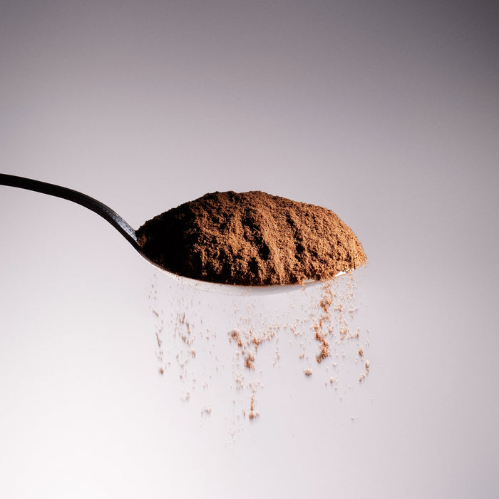 Dolce Superfoods organic Ceylon cinnamon powder on metal spoon