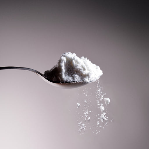 Dolce Superfoods organic coconut milk powder on metal spoon