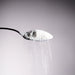 Dolce Superfoods organic coconut water powder cascading off of a metal spoon