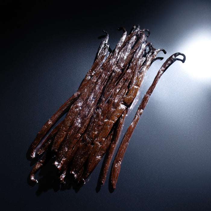 Dolce Superfoods Madagascar vanilla beans on dark background