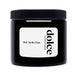 Black jar of bulk vanilla paste with Dolce Superfoods label