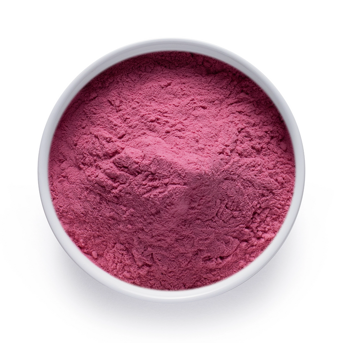 Dolce Superfoods organic cranberry powder in white bowl on white background